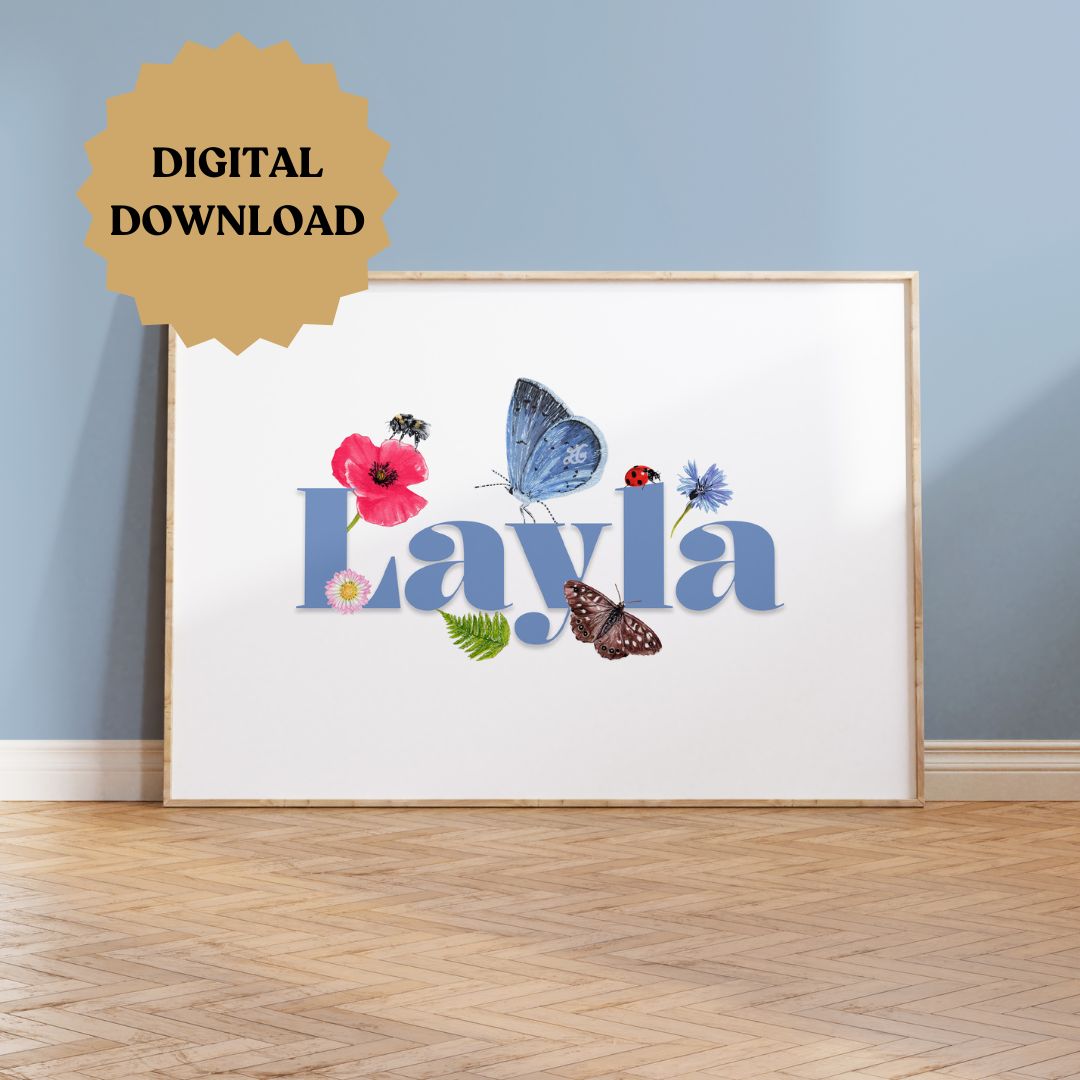 Personalised wildlife meadow name print with "Layla" in soft blue, framed on a wooden floor against a painted blue wall, featuring UK meadow flowers and insects.