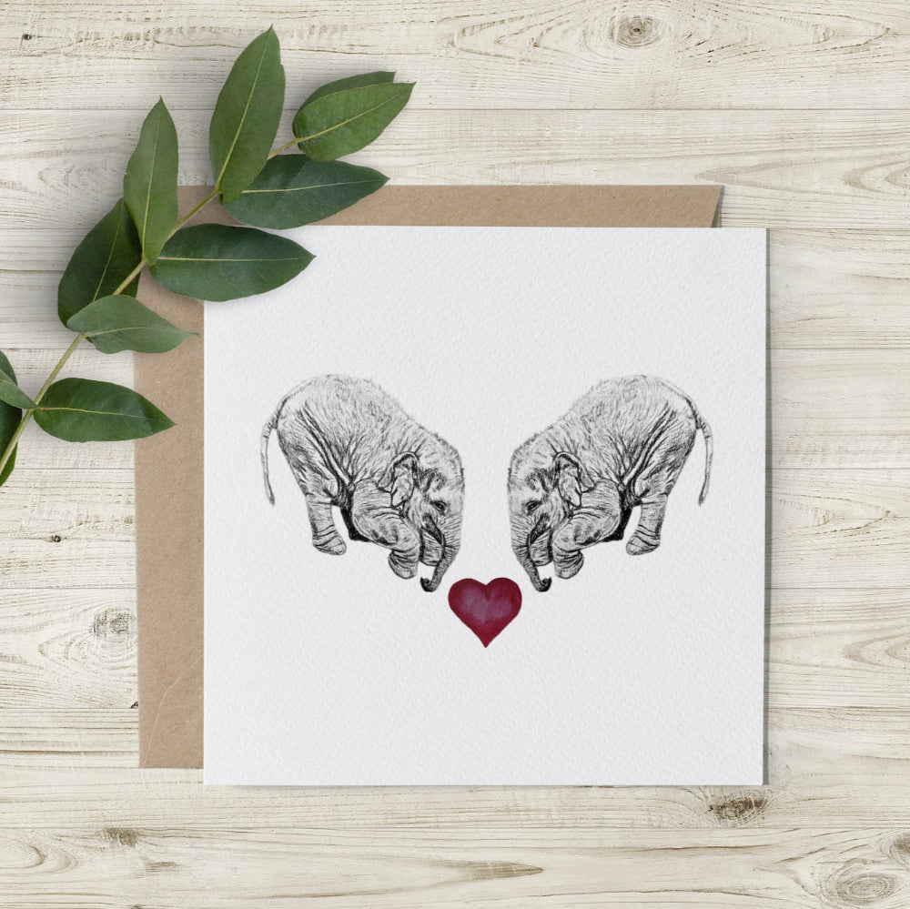 Eco-friendly Elephant & Heart card, hand-sketched by Emma Gorton, perfect for Valentine's and anniversaries. Featuring watercolour heart and elephants.