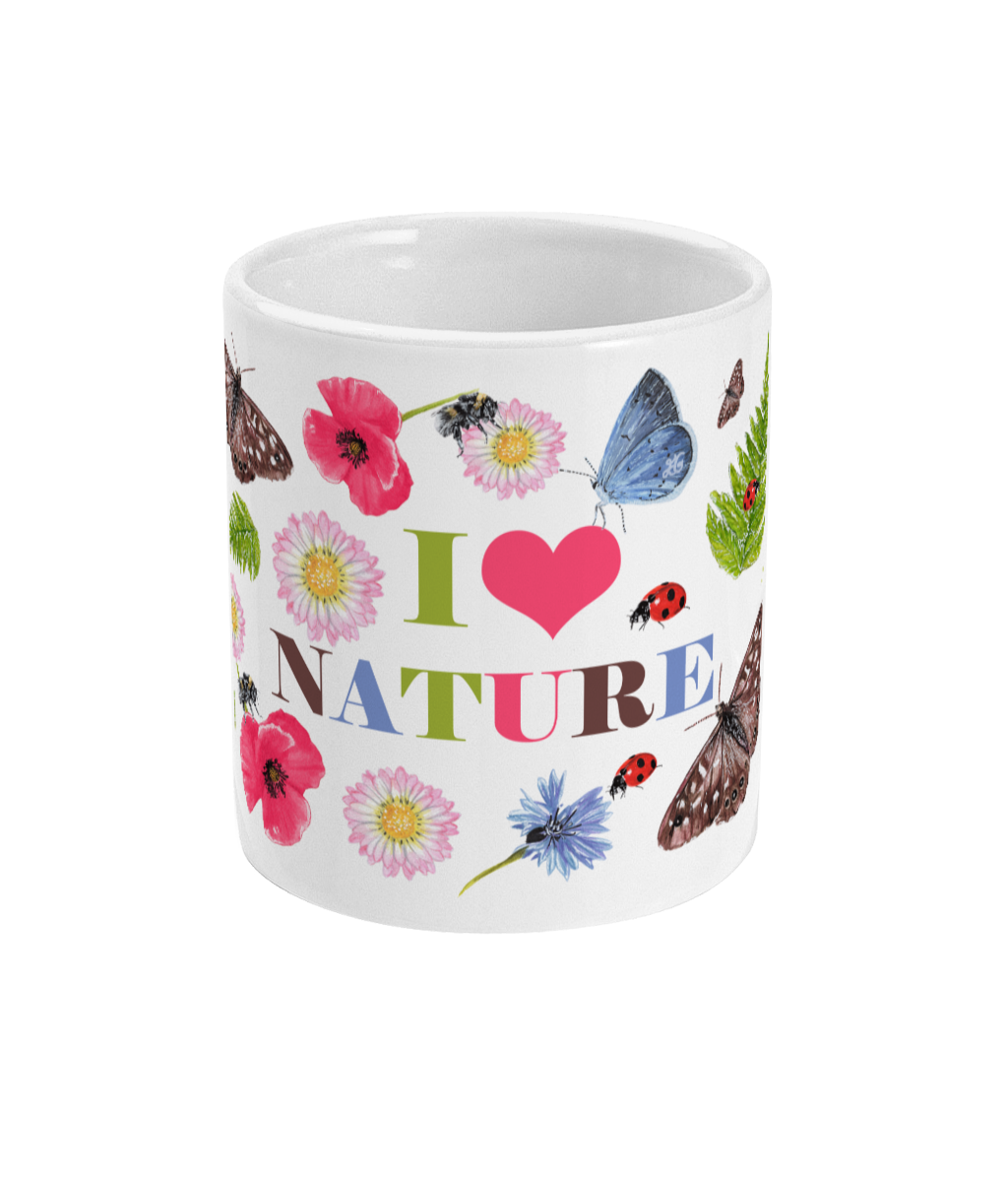 Front view of white ceramic mug with bees, butterflies and flower design on a plain white background.