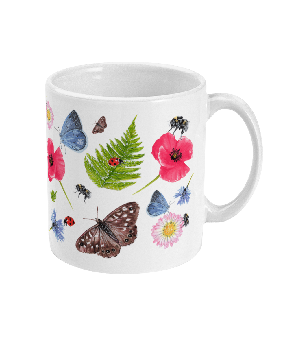 Right side of ceramic mug with Summer Meadow print including wildflowers, ladybirds and butterflies, photographed on white background