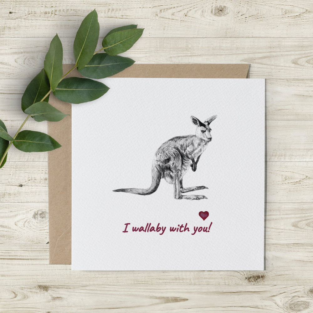 Eco-friendly Valentine’s card featuring hand-sketched wallaby and 'I Wallaby With You' text, with little red watercolour hearts, made in the UK